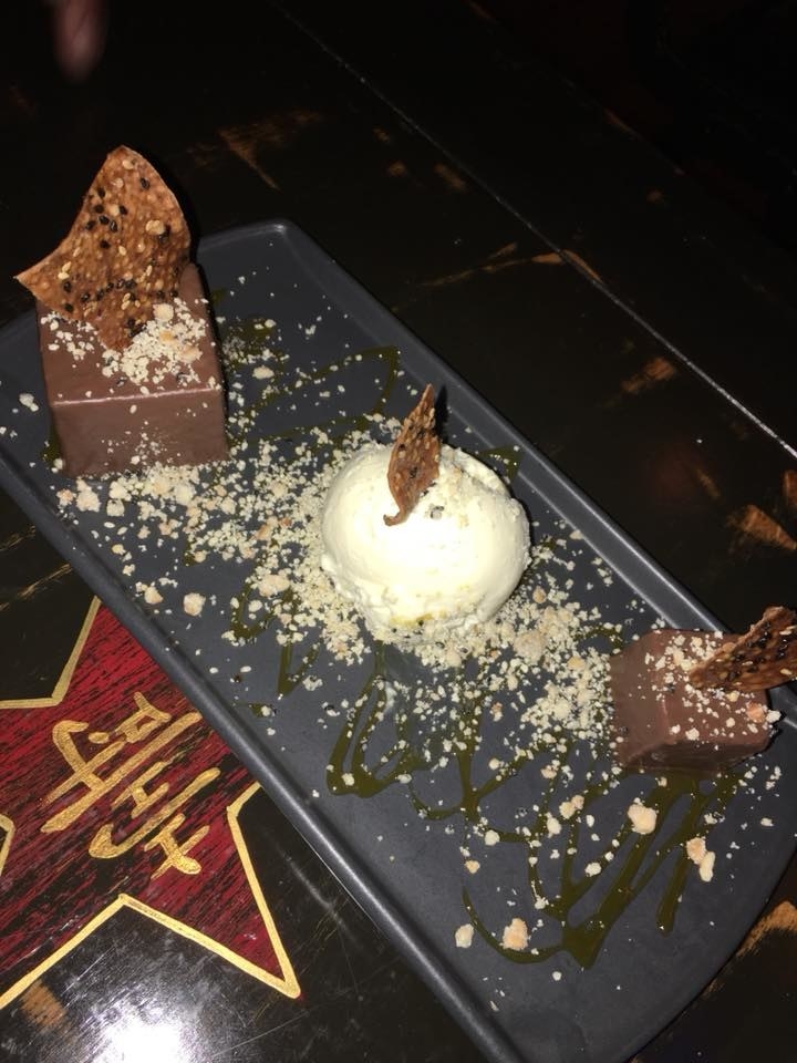 Imagine creamy rice pudding encapsulated in chocolate shells. The Chocolate Arroz Con Leche is nothing like what I've tasted before. The dessert is paired with tangy ginger gelato with crunchy cashew sesame crumb, sweet sesame wontons, and passion fruit caramel for an explosion of flavors and textures.