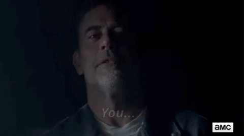 It could simply mean he's about to blow his mind with information, or surprise him in some way. More importantly, GABRIEL HAS A GUN, yet he doesn't immediately kill Negan, instead he listens to his shit your pants spiel.