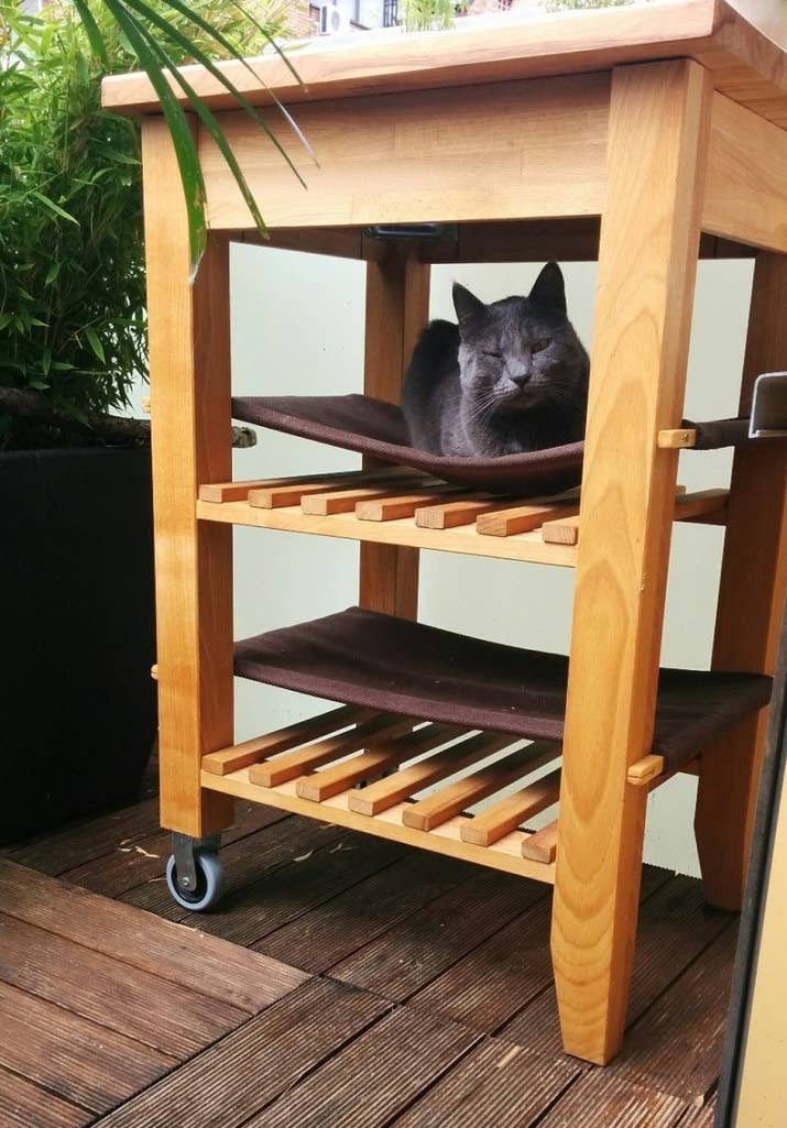This one is handy for both work and play, since it's got a work surface/storage area up top, and then space for two fun cat hammocks down below! Find out how to convert your Bekväm kitchen cart here.