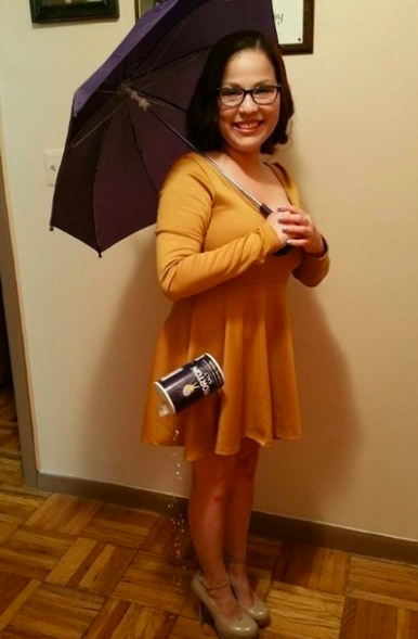 girl wearing yellow dress with umbrella