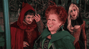Three witches from Hocus Pocus smiling and laughing