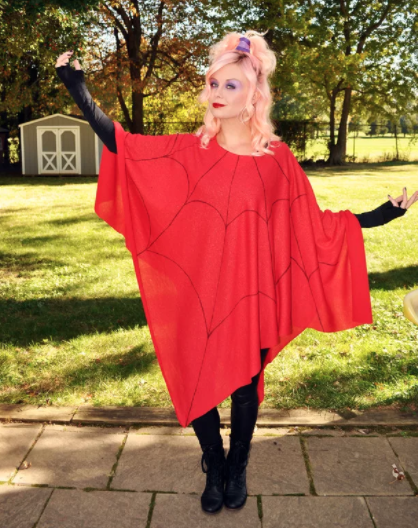 girl in a red spiderweb poncho