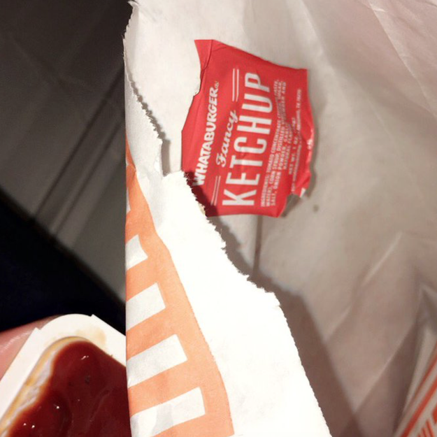 Discarded ketchup wrappers by sticking them to the inside of your takeout bag.