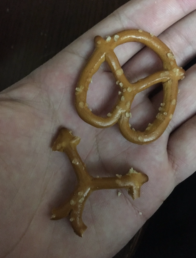 Eaten the outside of a pretzel first, turning it into a new shape.