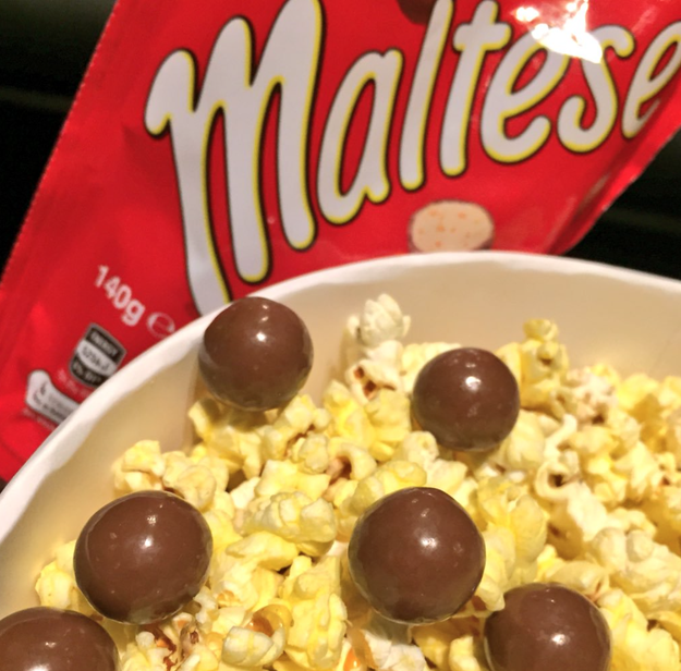 Eaten popcorn with chocolates because salty and sweet mixtures are the best.