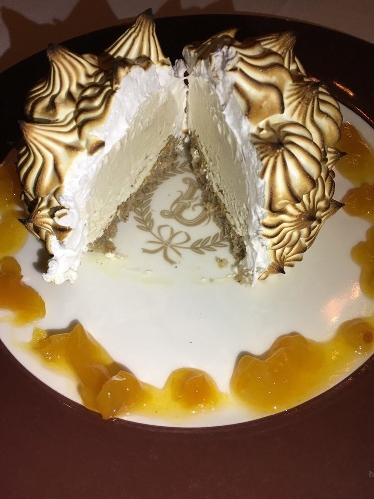 Created by Charles Ranhofer in 1867, the Classic Baked Alaska is a true original and a signature dessert at Delmonico's. Underneath the baked meringue is moist walnut cake topped with banana gelato and served with apricot jam.