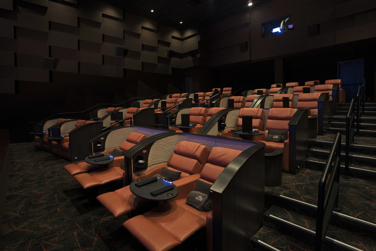 You can truly relax while lounging on the full reclining seats at iPic Theaters, which are reminiscent of first-class airline cabin. These premium seats also include wait service, unlimited popcorn, blankets, and pillows. Just don't fall asleep during the movie!