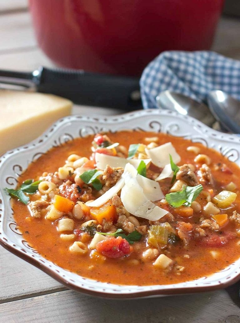 bowl of soup with freshly grated cheese on top