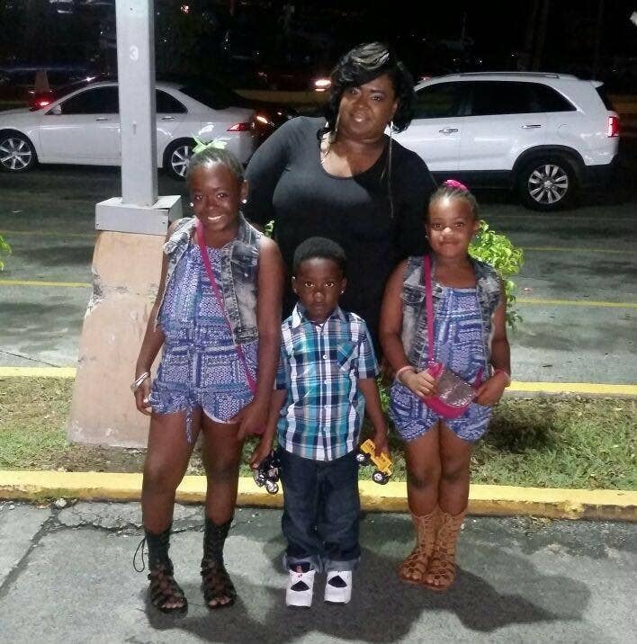 LaToya O'Neal and her three children before the hurricanes.