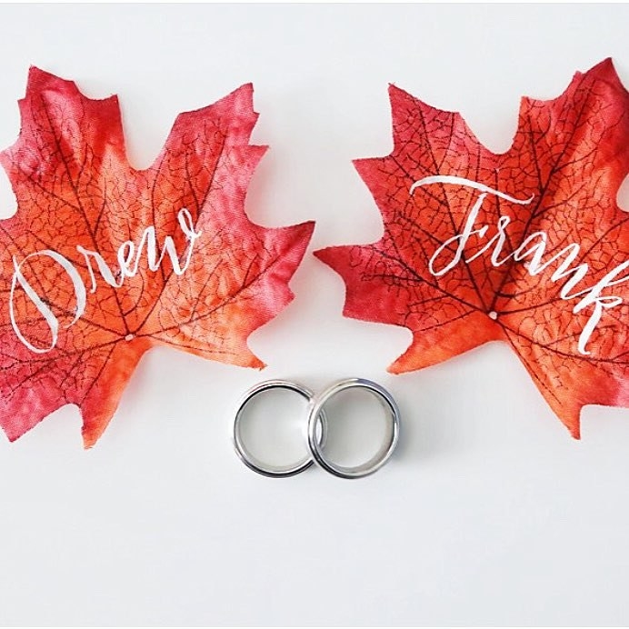 Need we say more? A fall wedding wouldn't be right without some fall foliage. These escort cards calligraphed by Fleur De Letters is fall perfection.
