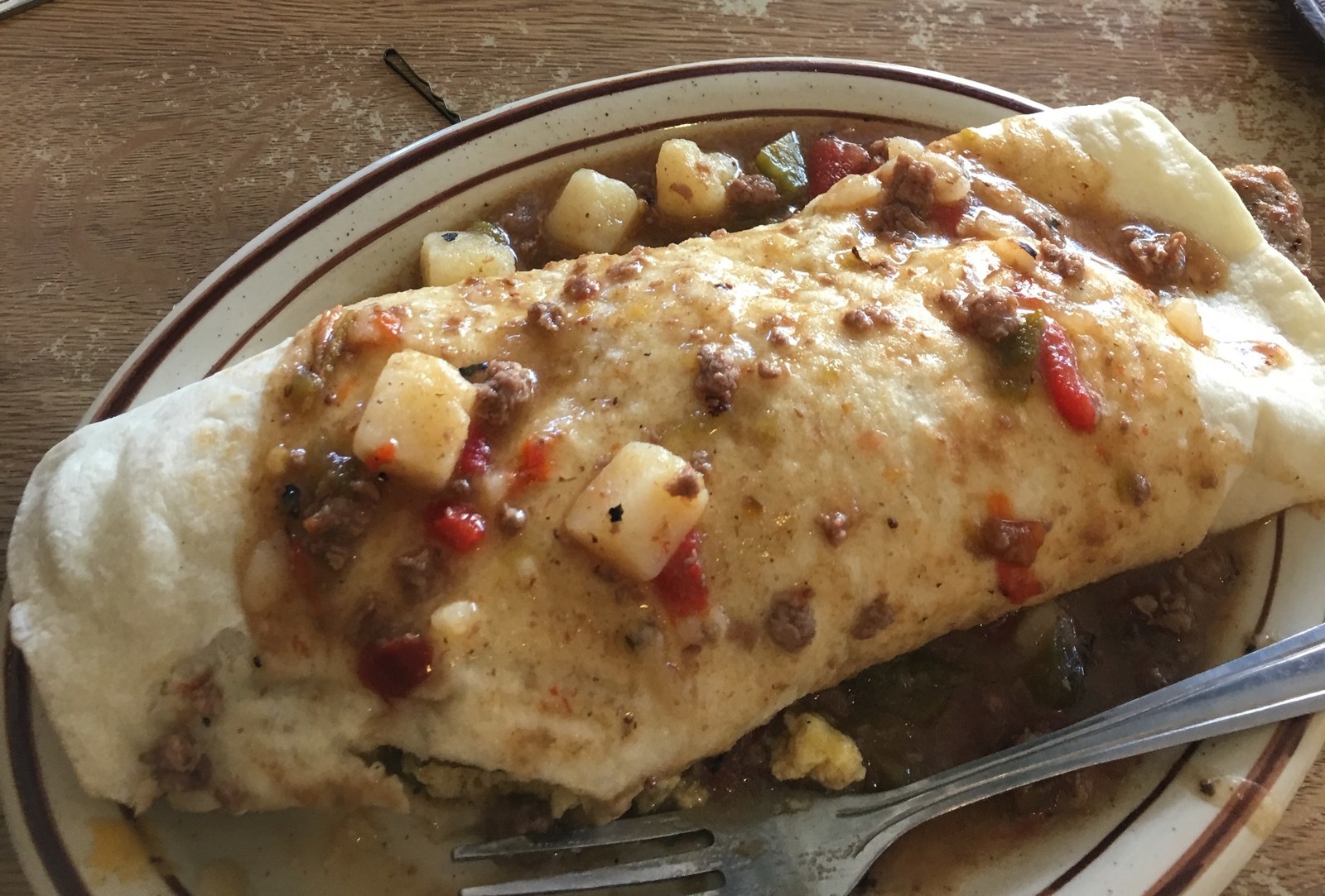 The balloons will stop launching around 9 am so they can prepare for the evening session. No worries. This will give you ample time to fill your belly once more with delicious food in the Albuquerque area. It is a little bit of a drive, but the cost and the quality of food is definitely worth it. Depending on where you are, it could take up to 30 minutes for your to arrive at the Frontier Restaurant. It is a quaint little place just on the corner, but it is constantly filled with people salivating over their scrumptious breakfast. You will never have to wait for your breakfast for longer than ten minutes, but you will want to make sure you find a seat before you order. That's why it's best to have a buddy with you (thanks Sami). Our food of choice for this trip were two of their breakfast burritos at just $5 a piece a cup of hot cider and a cup of coffee, totaling out to be $17. Before you leave, make sure you chow down on one of their sweet and famous cinnamon rolls.