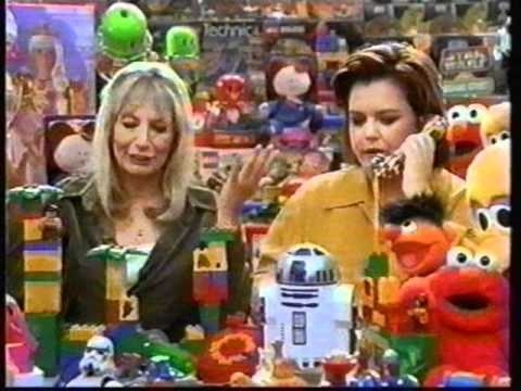Penny Marshall and Rosie O&#x27;Donnell sitting surrounded by toys