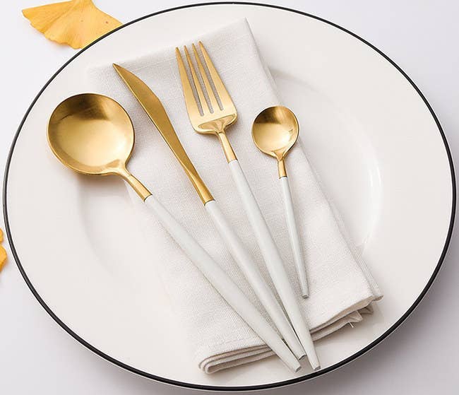 A Set Of Modern Kitchen Utensils In A Minimalist Style On A White
