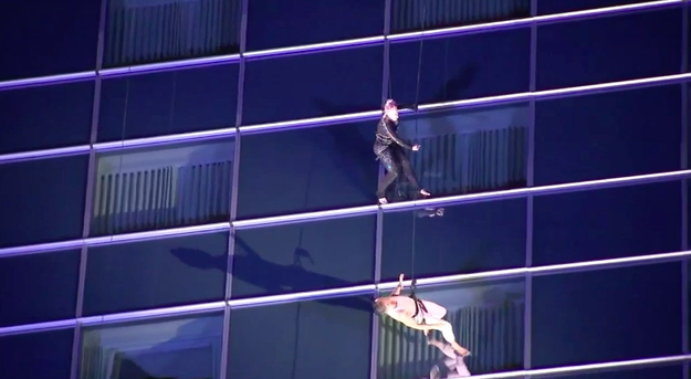 Our queen was seen with some aerial artists rehearsing on the side of a motherflippin' skyscraper in downtown Los Angeles.