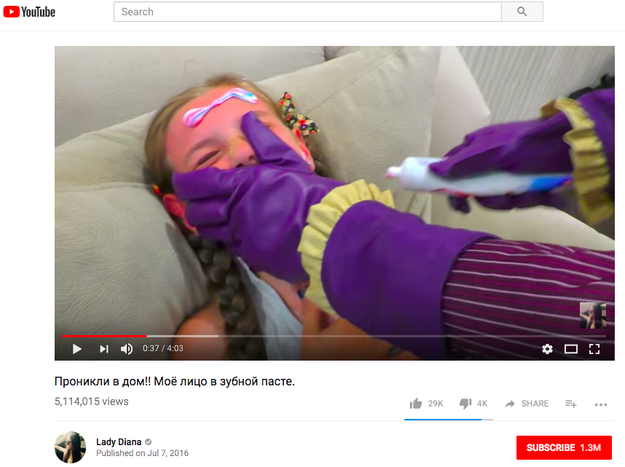 In a video with more than 5.1 million views, a screaming child is being held down while toothpaste is smeared on her face by a man in a 'Joker' costume.