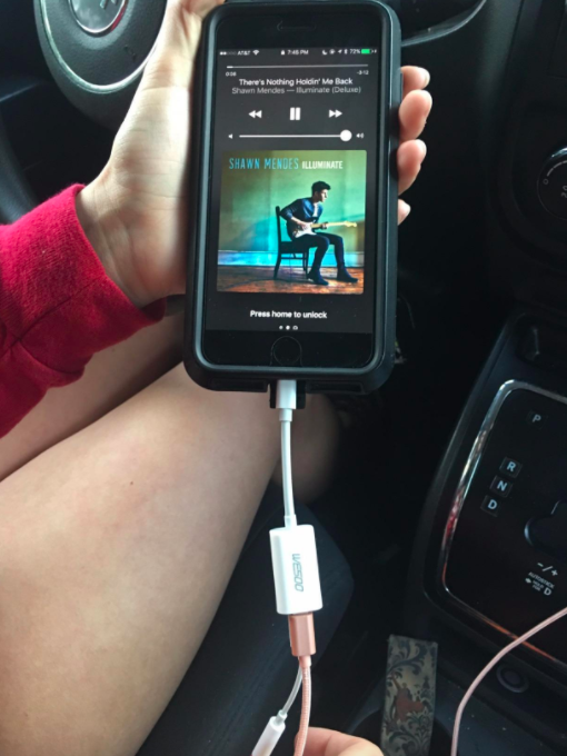 An iPhone adapter so you can charge your phone and listen to music at once!