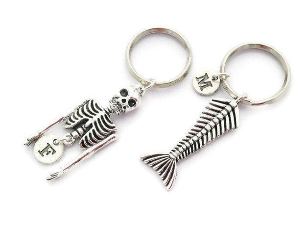 A pair of matching mermaid skeleton keychains to give as a gesture that says "you complete me."