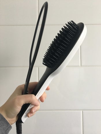 the tool, which has a brush and a clamp