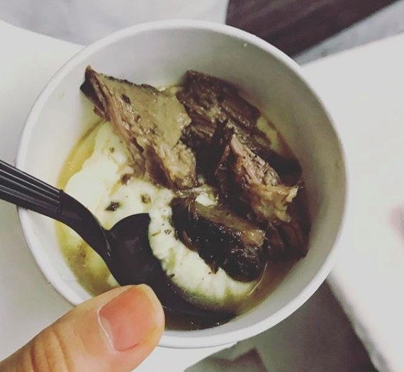 Tender pieces of fall-off-the-bone beef short ribs was served over creamy polenta in this savory, juicy dish.
