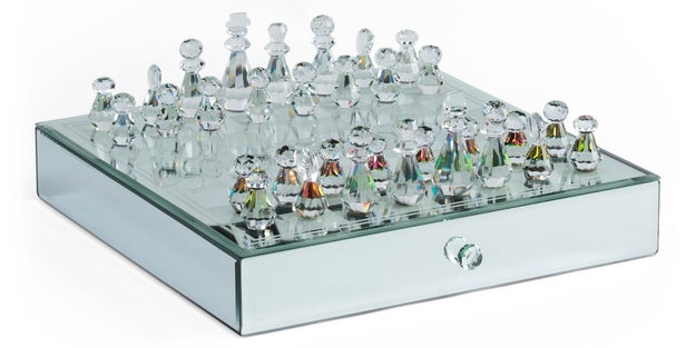 A stunning mirror-finish chess set with silver-toned and rainbow iridescent pieces that'll look gorgeous on any table.