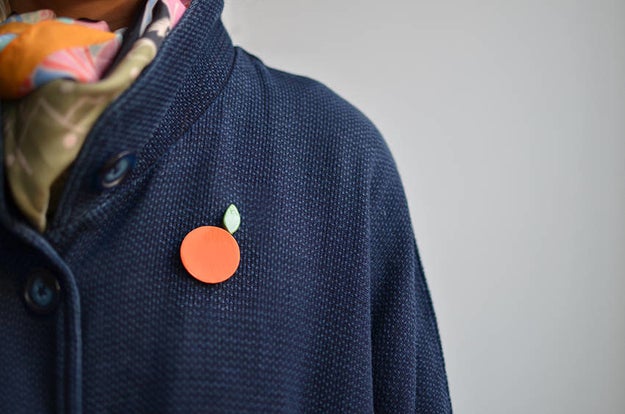 A summery ceramic brooch duo so you can say "orange you glad you have me as a friend?"