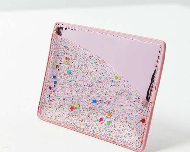 A glittery card case — it can easily transfer your wallet essentials to a tiny purse.