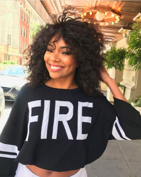 Nothin' to see here, folks. Just Gabrielle Union, living her best 45-year-old life with her angel-soft baby skin and Fire Sweater from her very own collection with New York &amp; Co.