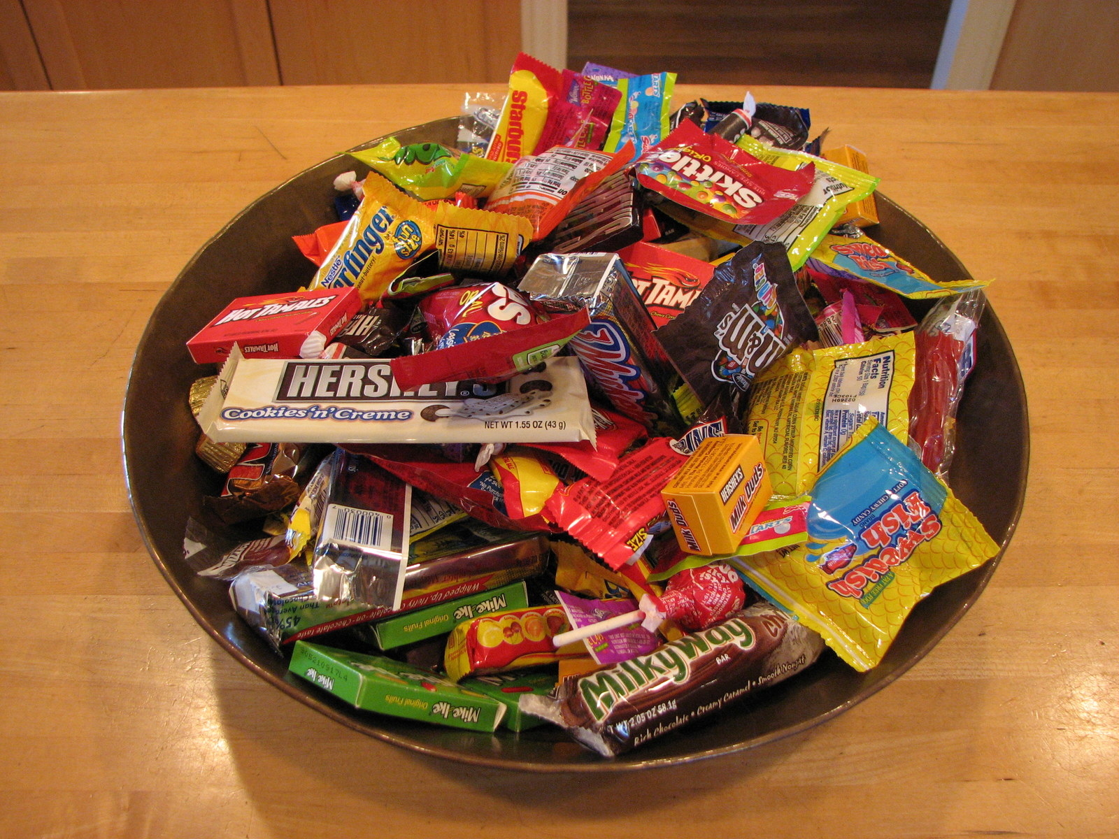 You don't even have to bake! Just have a bowl out with your leftover candy and have it available for the whole family. An easy solution to getting rid of your leftover Halloween candy.