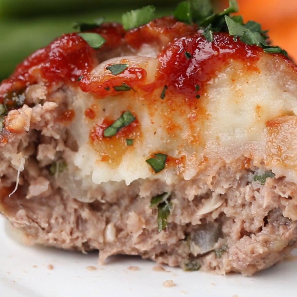 10 meatloaf cupsINGREDIENTSMashed Potatoes455 g (1 lb) potato, cooked and peeled2 tablespoons butter1 teaspoon salt1/2 teaspoon pepper50 g (1/2 cup) shredded parmesan cheese235 mL (1 cup) milkMeatloaf Glaze180 g (3/4 cup) ketchup2 tablespoons tomato paste55 g (1/4 cup) brown sugar1 teaspoon onion powder1 teaspoon mustard powder1 teaspoon paprikaMeatloaf1 tablespoon cooking oil150 g (1 cup) onion, diced1 tablespoon garlic, minced455 g (1 lb) ground beef, 85%/15% fat1 teaspoon salt1 teaspoon pepper1 teaspoon worcestershire sauce50 g (1/2 cup) shredded parmesan cheese10 g (1/4 cup) fresh parsley1 egg, beaten25 g (1/2 cup) panko breadcrumb60 mL (1/4 cup) milkPREPARATION1. Preheat oven to 350˚F (180˚C).2. Place cooked potatoes into a large bowl. Add butter, salt, pepper, parmesan, and a splash of milk. Mash and add more milk gradually until the potatoes are the desired texture. Set aside and let cool.3. Prepare the glaze by mixing ketchup, brown sugar, onion powder, mustard powder, and paprika in a bowl. Reserve half in a separate bowl to glaze once cooked.4. Add oil in a skillet over medium heat, followed by onions and garlic. Cook until onions are translucent and fragrant. Set aside in a bowl to cool before adding to the meat mixture.5. In a large bowl, combine ground beef, salt, pepper, worcestershire sauce, parmesan, parsley, cooled onions & garlic, egg, breadcrumbs and milk. Mix until combined.6. Using a spoon or ice cream scooper, scoop the meat mixture and place into a greased 12 cup cupcake baking tin.7. Using your fingers, spread the meat from the center to make a cup. Fill the middle with a small spoonful of mashed potatoes, and cover back up with the meat mixture.8. Generously brush half of the reserved glaze on top of the meatloaf cups generously.9. Bake for 25 minutes, reapplying the glaze halfway through. Once they are done cooking, brush with the remaining glaze that has Not been used on the raw meatloaves.10. Enjoy!Inspired by:http://realfoodbydad.com/epic-meatloaf-stuffed-with-mashed-potatoes/