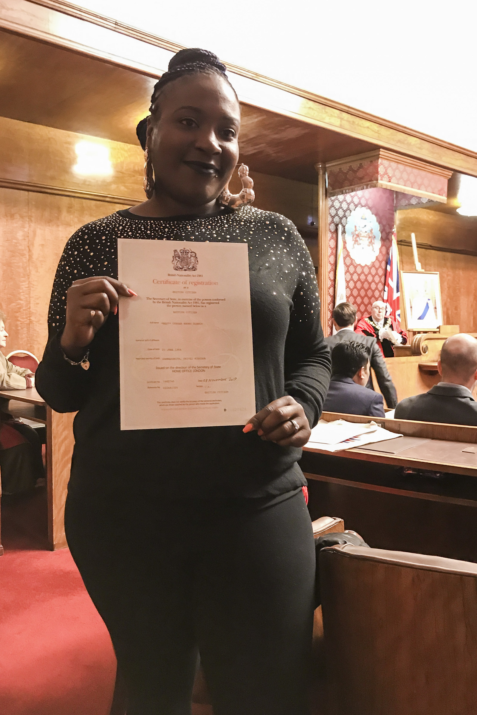Cynsha Best with her certificate of citizenship