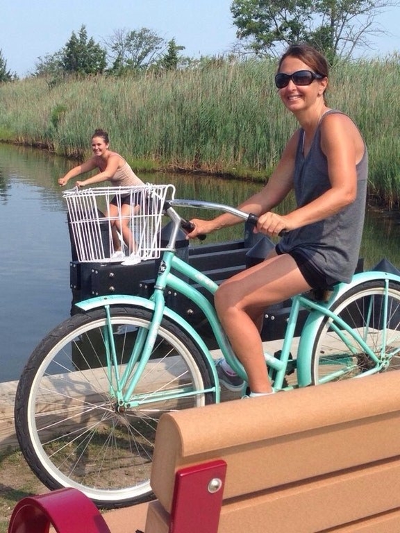 This woman taking her sister for a bicycle ride.