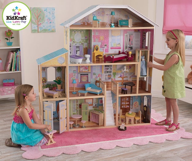 A truly giant dollhouse mansion complete with eight rooms, 34 pieces of furniture, an elevator, and large windows so you can look at it from all angles.