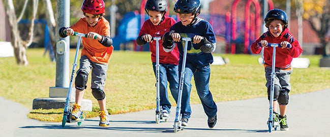 kids riding scooters