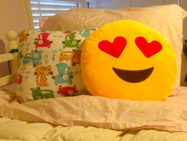 An emoji pillow to show them just how you feel about them, in the language they know best.