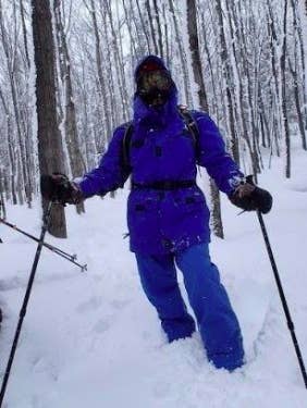 person skiing in the woods