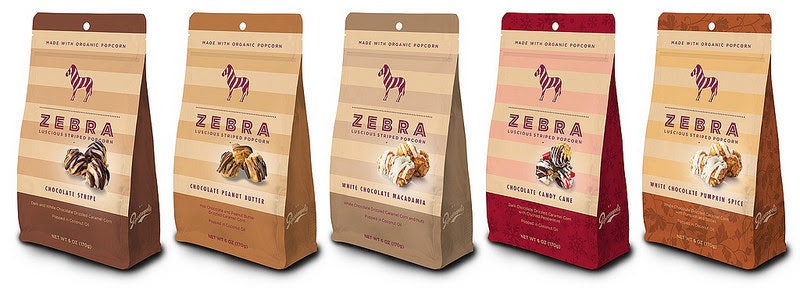 Family-owned-and-operated artisan popcorn purveyor, Popcornopolis, launched a delicious new product line called Zebra by Popcornopolis® —five indulgent, confection-style gourmet popcorn snacks made with organic popcorn, premium chocolate, and hand-selected ingredients with no artificial colors, flavors, or preservatives. The decadent chocolate-drizzled snack line, developed by Popcornopolis’ Cordon Bleu-trained chef, features five innovative varieties inspired by the brand’s popular Zebra® Popcorn.