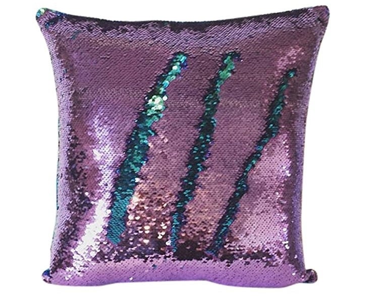 the pillow showing purple sequins with teal ones popping through underneath 