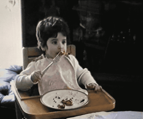 Yep, that's two-year-old me devouring a parmigiana.