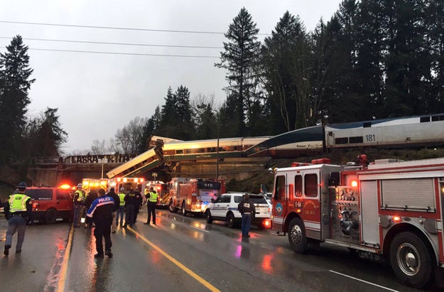 Pictures and videos from the scene show one train car smashed into the ground, while another is dangling off the overpass: