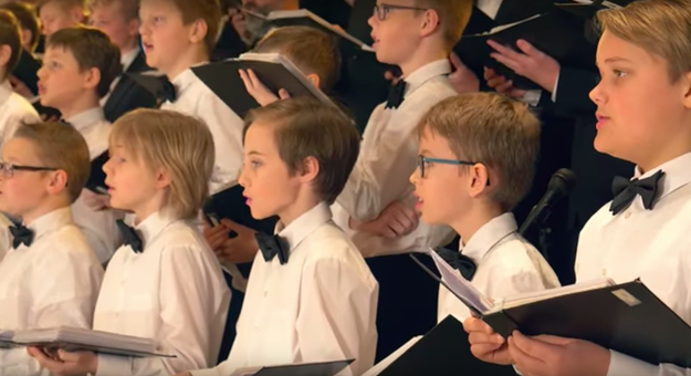 The video starts off with the boys singing an angelic rendition of "O Come, All Ye Faithful."