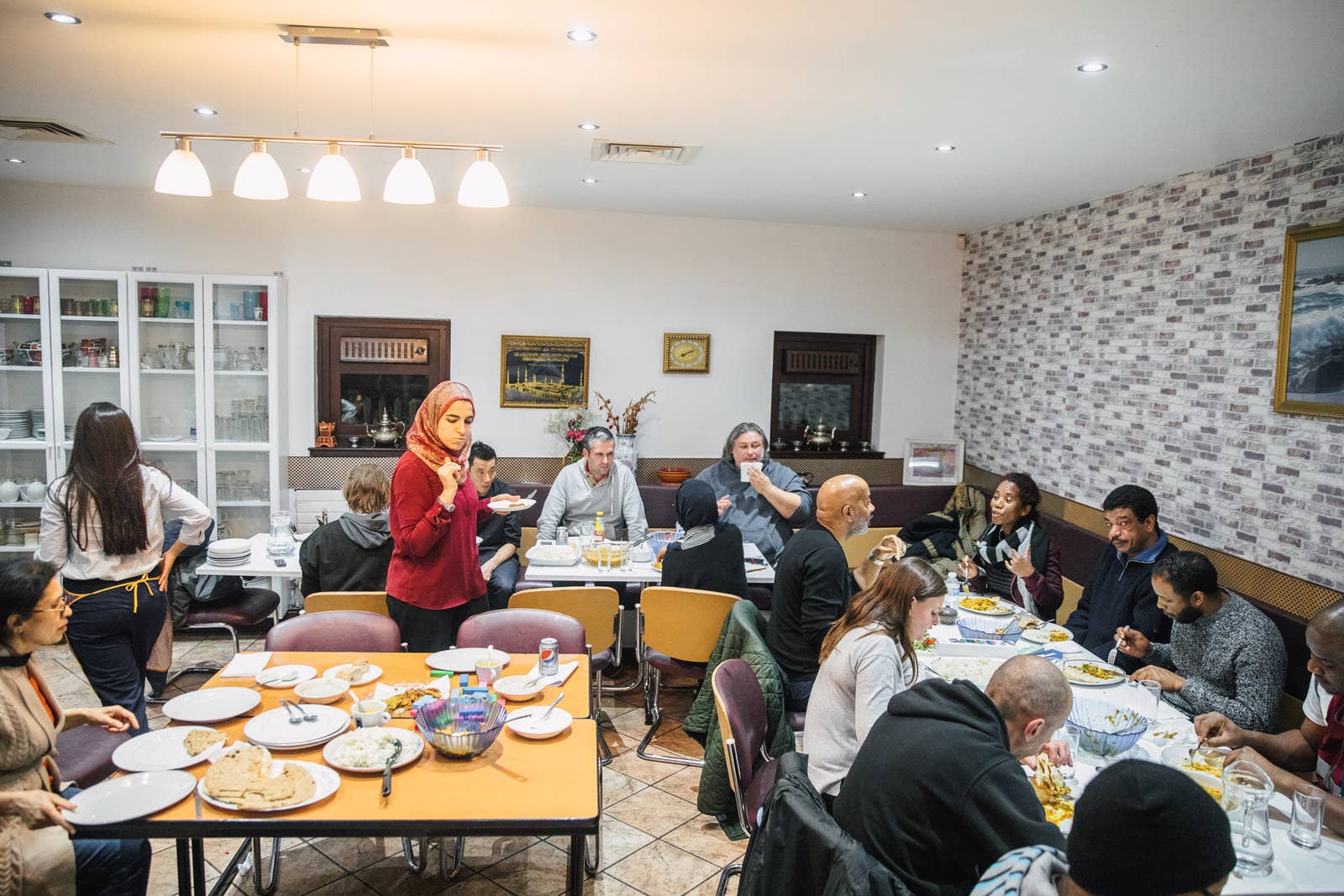 Guests and volunteers tuck into the evening meal.