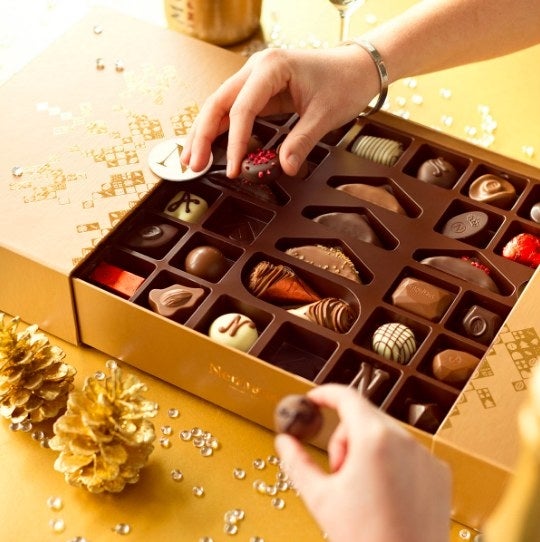 This notable Belgian chocolatier is featuring new Premium Winter Gift Box with 62 tempting Belgian chocolates. The gift box, which includes 62 iconic Neuhaus milk, dark, and white chocolates imported fresh from Belgium, is a luxurious treat that will impress anyone. The elegant bronze gift box is adorned with a metallic snowflake motif. With plenty to share, this luxury holiday gift box is an ideal gift for families, corporate gifting, and hostess gifts.