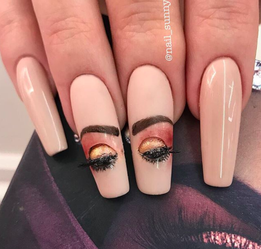 At first glance, this looks like some regular ol' nail art but then wait a sec...are those eyes closed now?