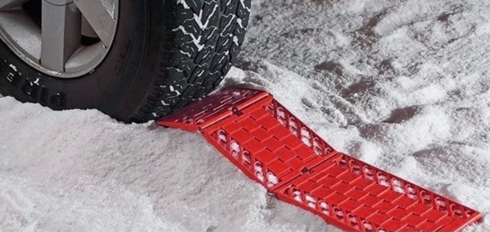 Promising review: "We bought these last winter but didn't need to use them then. They were needed a couple of days ago, and they worked great. A neighbor's car got stuck on the hill trying to turn into a driveway. Someone tried to tow the vehicle but couldn't get traction. Then I brought these out, and we placed them right in front of the front tires. With a few of us pushing the vehicle, the tires got traction and the car was able to get into the driveway. I like that they're foldable; that makes it easier to store them in the back of the car in the winter." —LJGet them from Amazon for $17.99 or Walmart for $16.99.
