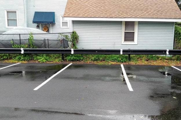 This parking lot continues the divider lines up onto the barrier, making them easier to see when you're in the car.