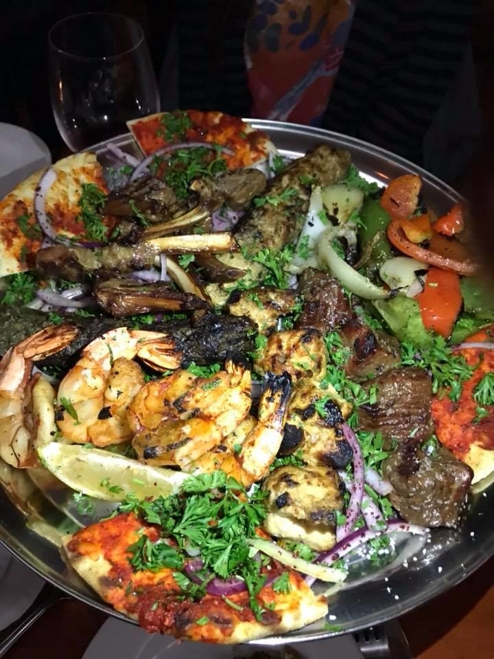 This ultimate meat-lovers' platter is a sight to see...and eat! You can indulge in the true surf & turf with plump Grilled Shrimp, as well as Chicken Kebab (char-grilled chicken cubes marinated in lemon & herbs), Chicken Kafta Kebab (char-grilled seasoned ground chicken), Grilled Kafta Kebab (lean ground beef & lamb mixed with chopped onions, parsley, herbs & spices), Filet Mignon Shish Kebab, and za'atar marinated Baby Lamb Chops.