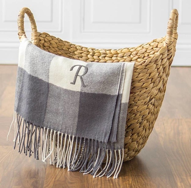 A machine-washable monogrammed throw blanket, because you're sick of Netflix and chilling — you want to Netflix and be warm damn, it!