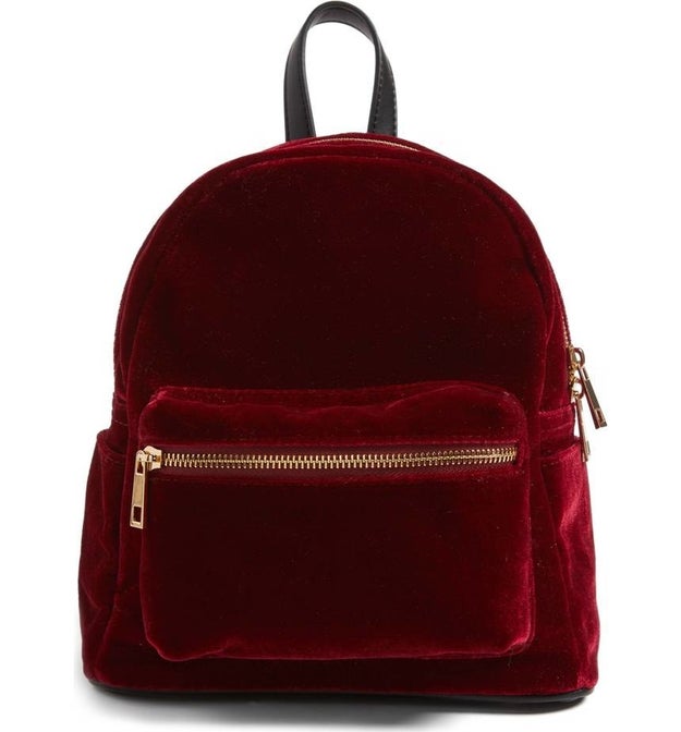 A velvet backpack, because decadence sure does equal thoughtful, and your friend's old bag is hanging on by a string.