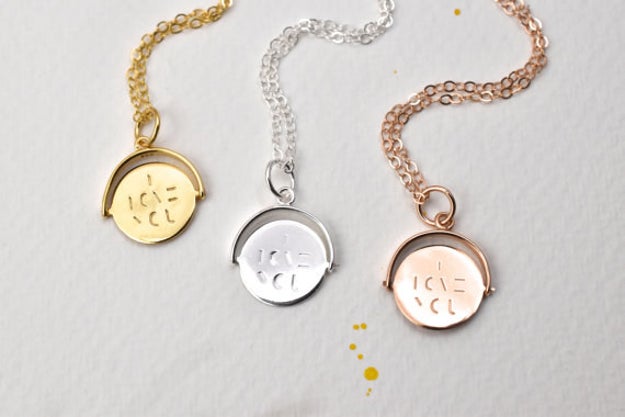 A pendant necklace with a hidden message so you two can be mushy even if you hate PDA.
