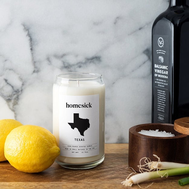 A candle that'll smell just like your friend's home state so they can remember all the good times while drinking a glass of merlot.